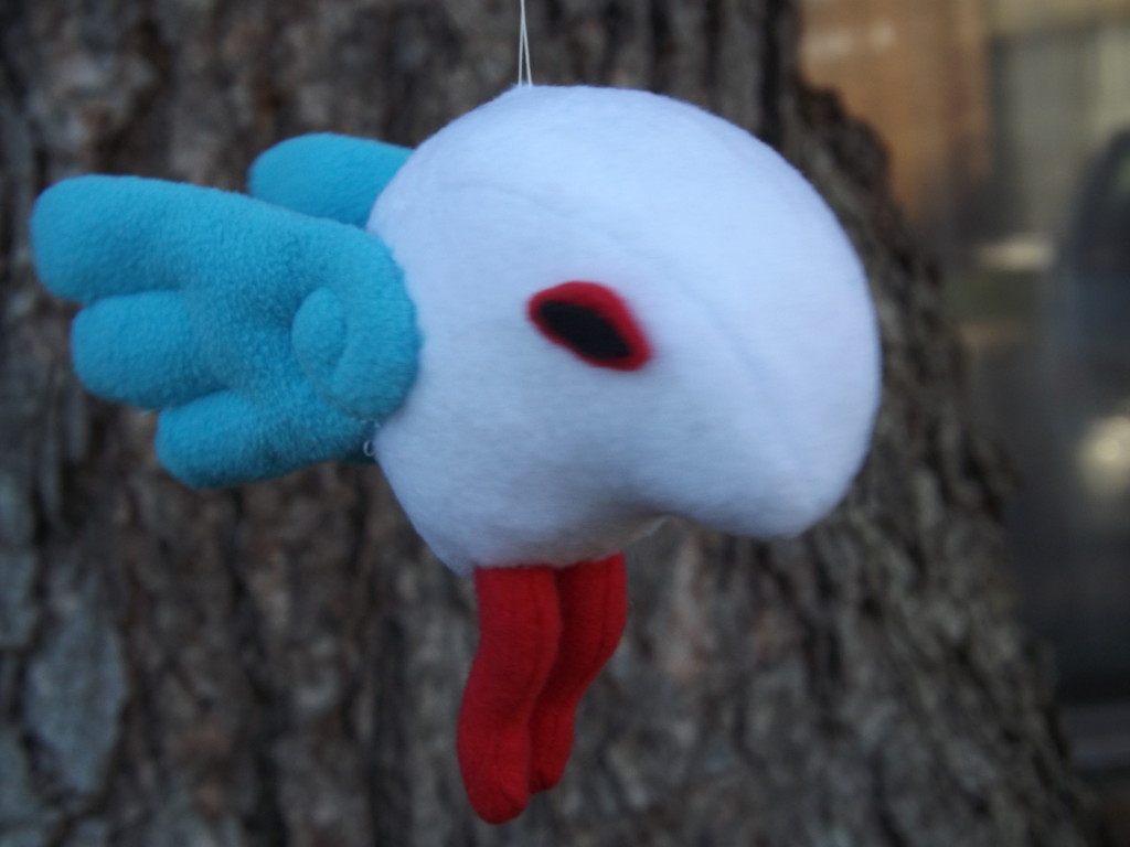 A photo of a white, blue, and red Sheerow plush.