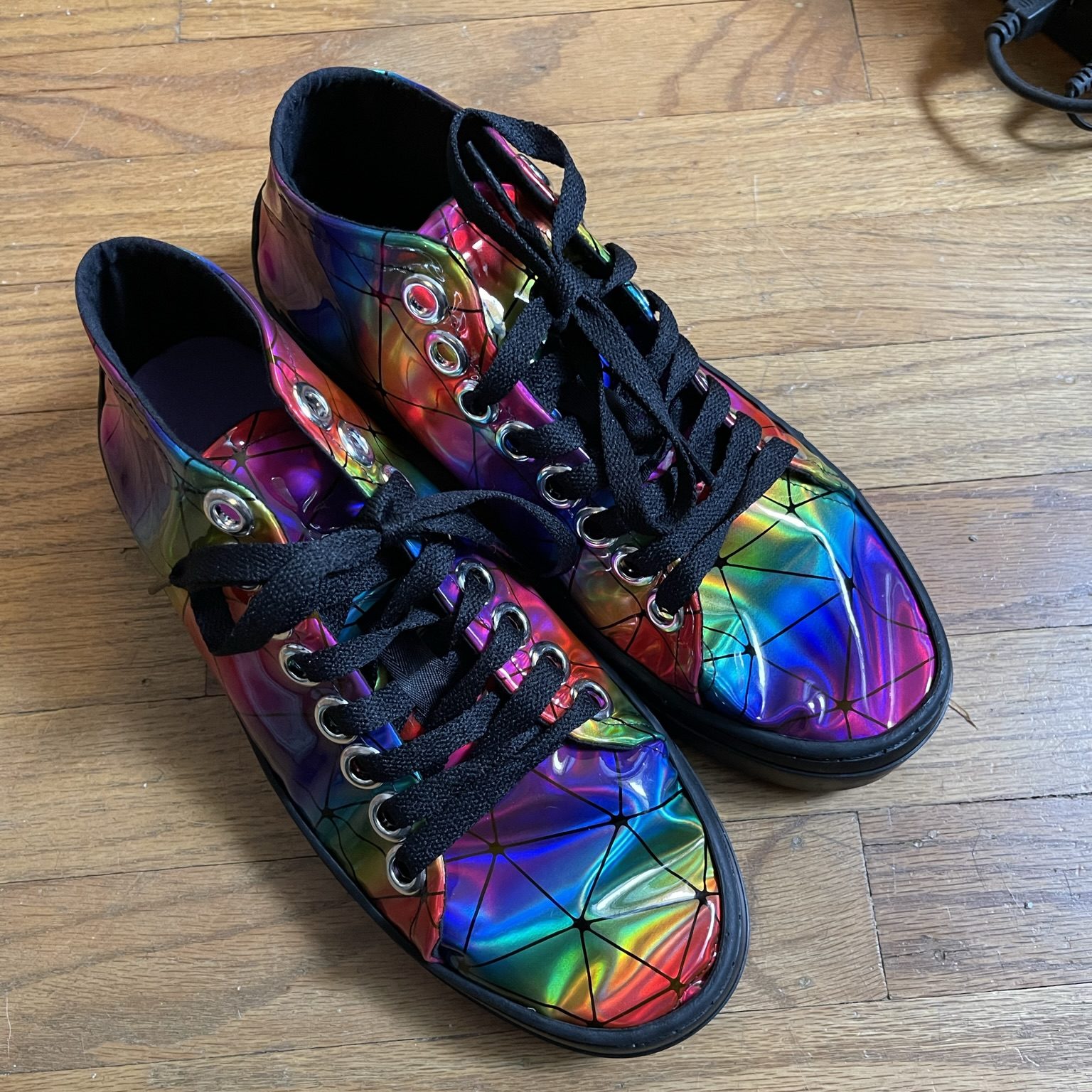 A top-down image of the finished rainbow vinyl shoes!
